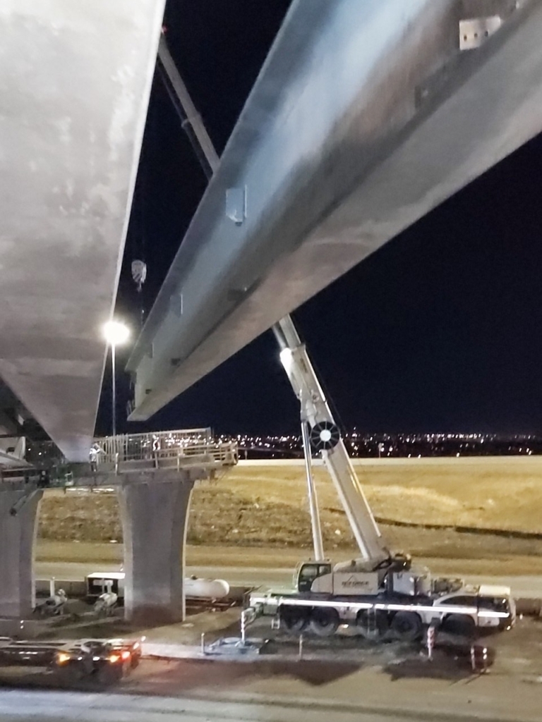 A girder being lowered into place 