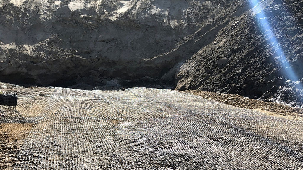 This polypropylene (plastic) geogrid improves the rigidity of the soil and gravel – this is known as tensile strength (stays together instead of pulling apart)