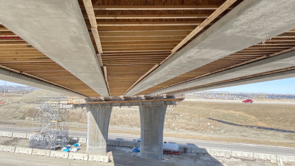 Deck joists are visible underneath the bridge