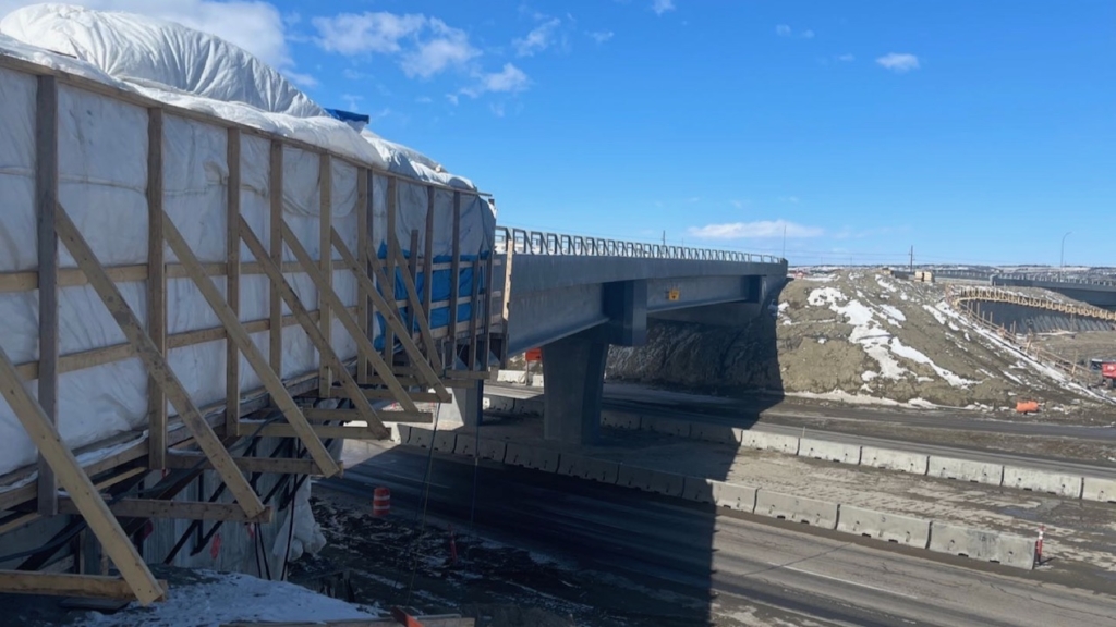 Looking north at the new bridge over the Trans-Canada Highway with the retaining wall and bridge pictured above on the right of the photo