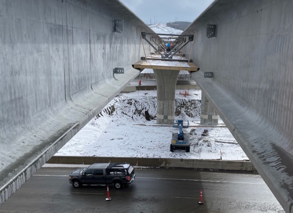 Looking south in between the girders; the ramp lanes from southbound Stoney Trail to eastbound Trans-Canada Highway are underneath